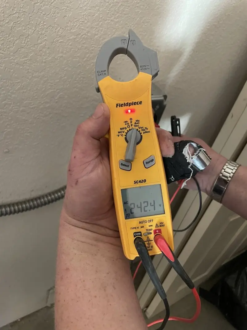 Voltage testing with clamp meter during Outlet Installation in Laredo